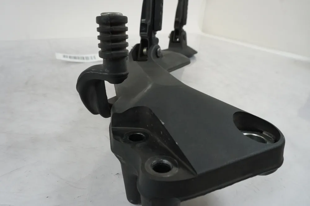 Držák na stupačky Husqvarna