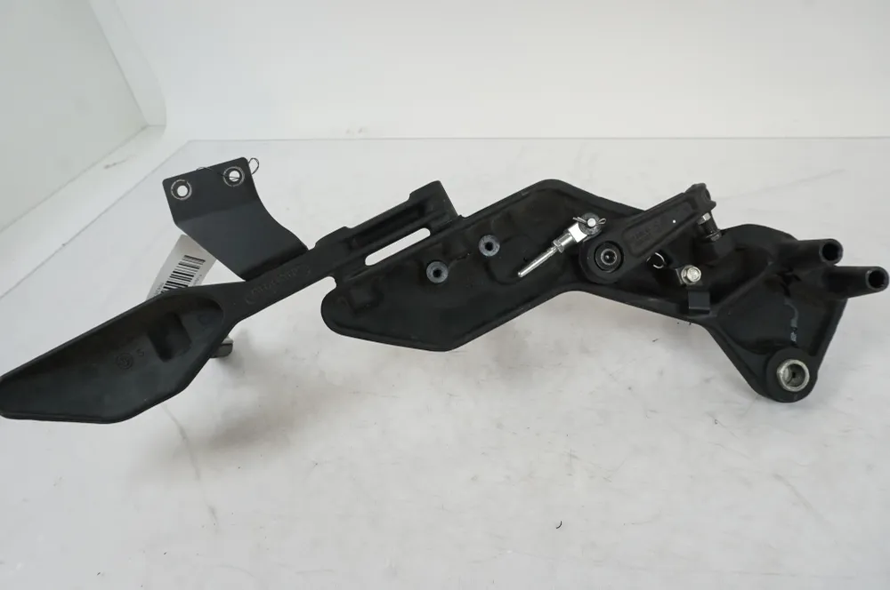 Držák na stupačky Husqvarna