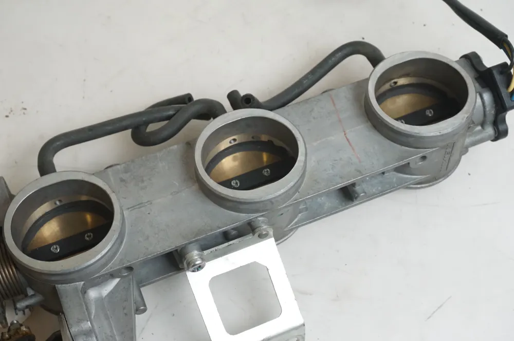 Těleso škrticí klapky Triumph